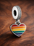 Rainbow Heart Charm - Rainbow Pride Heart Dangle Charm — display on walnut