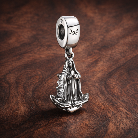 Virgin of Guadalupe Motif Dangle Charm — display on walnut