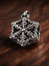 Sparkling Herbarium Cluster Charm — display on walnut