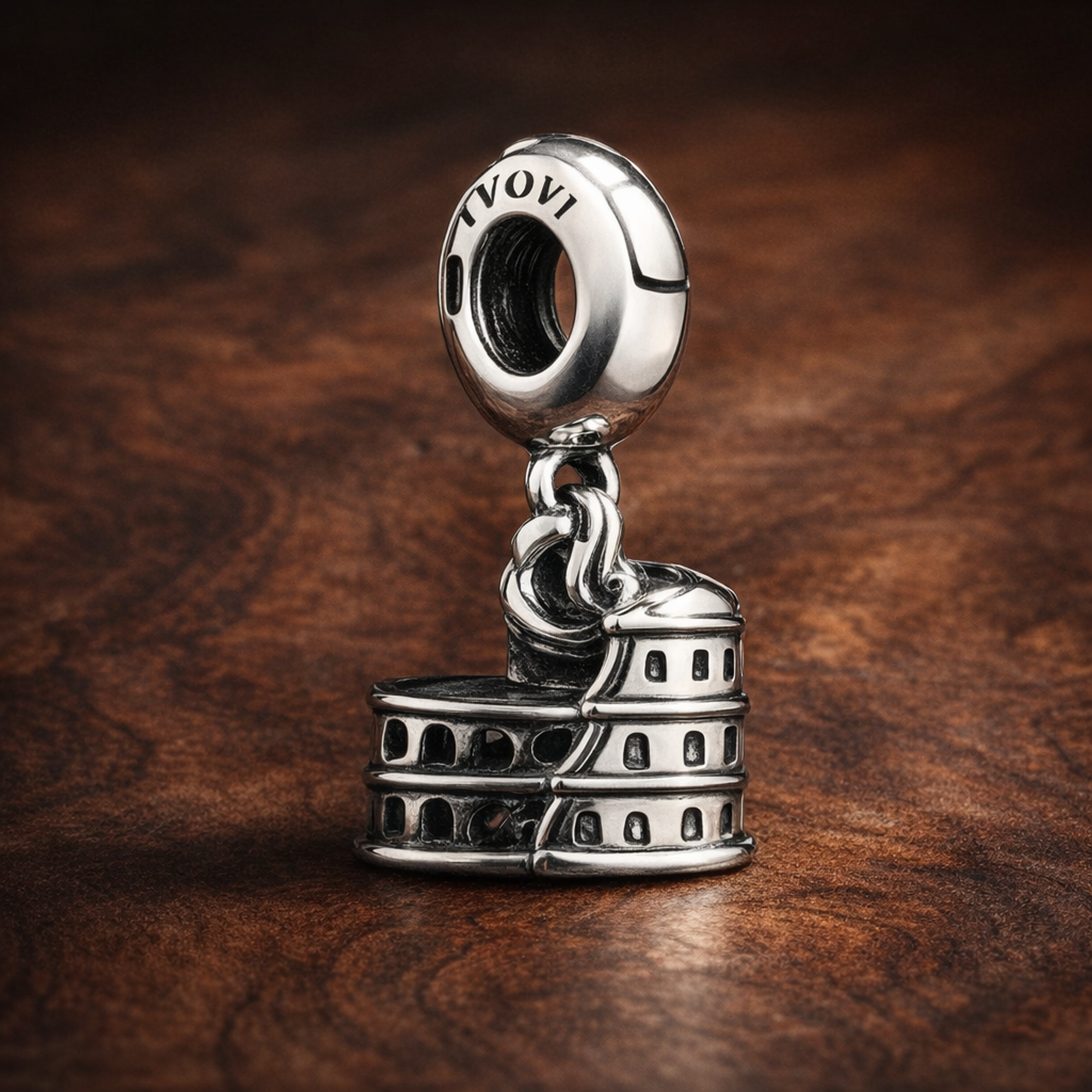 Colosseum Travel Charm - Roman Colosseum Dangle Charm — display on walnut