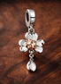 Peach Flower Charm - Peach Blossom Dangle Charm — display on walnut