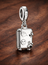 Suitcase Charm - Smiling Suitcase Travel Charm — display on walnut