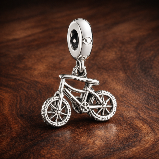 Bicycle Charm - Bicycle Dangle Charm — display on walnut