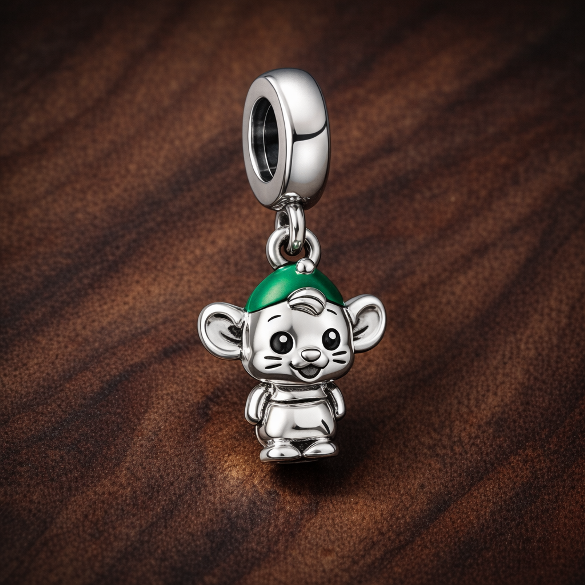 Monkey Elf Charm - Tiny Monkey with Green Hat Charm — display on walnut