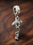 Shooting Star Charm - Shooting Star and Moon Dangle Charm — display on walnut
