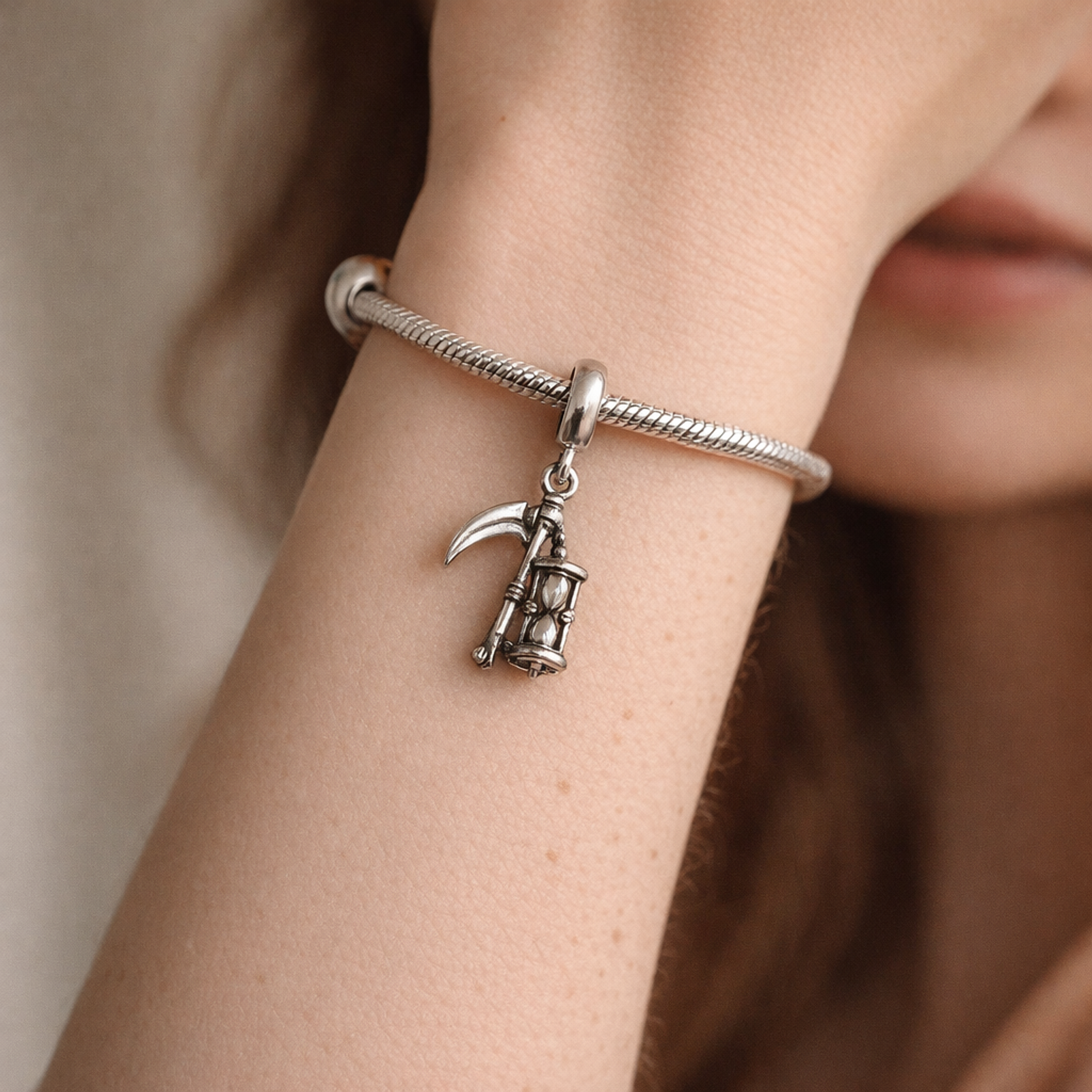 Abstract Dangle Charm - Minimal Abstract Dangle Charm — worn on wrist