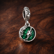 Green Earth Charm - Green Globe Earth Dangle Charm — display on walnut
