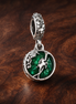 Green Earth Charm - Green Globe Earth Dangle Charm — display on walnut