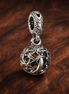 Nightmare Inspired Pendant - Striped Suit Character Dangle Charm — display on walnut
