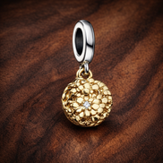 My Pandora Two-tone Daisy Double Dangle Charm — display on walnut