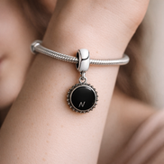 Icon Dangle Charm — worn on wrist