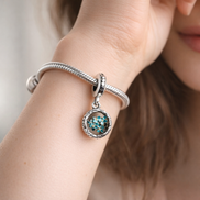 Turquoise Floral Charm - Turquoise Flower Medallion Charm — worn on wrist
