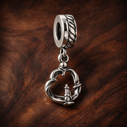 Pretzel Dangle Charm — display on walnut