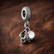 White Flower Charm - White Open Petal Flower Charm — display on walnut