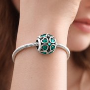 Green Heart Mosaic Charm - Green Heart Cutout Mosaic Charm — worn on wrist