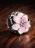 Pink Orchid Charm - Pale Pink Orchid Flower Charm — display on walnut
