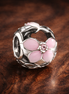Pink Flower Spacer Charm - Pink Flower Wrap Bead Charm — display on walnut