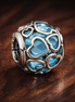 Blue Heart Mosaic Charm - Blue Heart Cutout Bead Charm — display on walnut