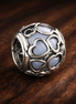 White Heart Mosaic Charm - White Heart Cutout Bead Charm — display on walnut