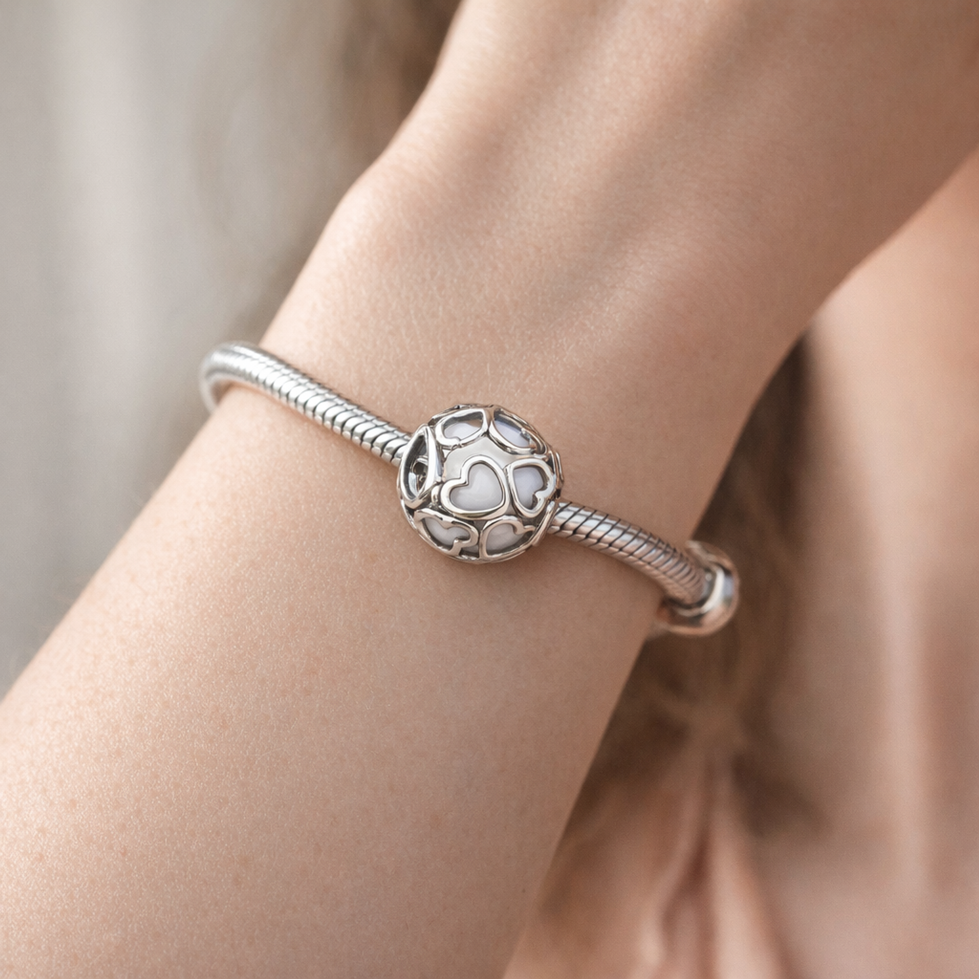 White Heart Mosaic Charm - White Heart Cutout Bead Charm — worn on wrist
