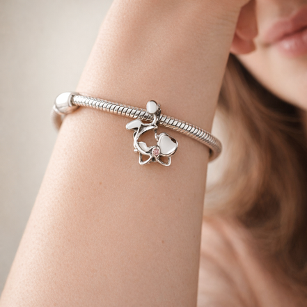 White Orchid Charm - White Orchid Flower Charm — worn on wrist