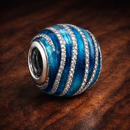 Blue Wave Charm — display on walnut