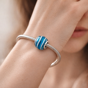 Blue Wave Charm — worn on wrist