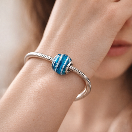 Blue Wave Charm — worn on wrist
