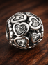 Black Heart Logo Charm - Black and Silver Heart Logo Bead Charm — display on walnut