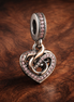 Two-tone Infinity Heart Double Dangle Charm — display on walnut