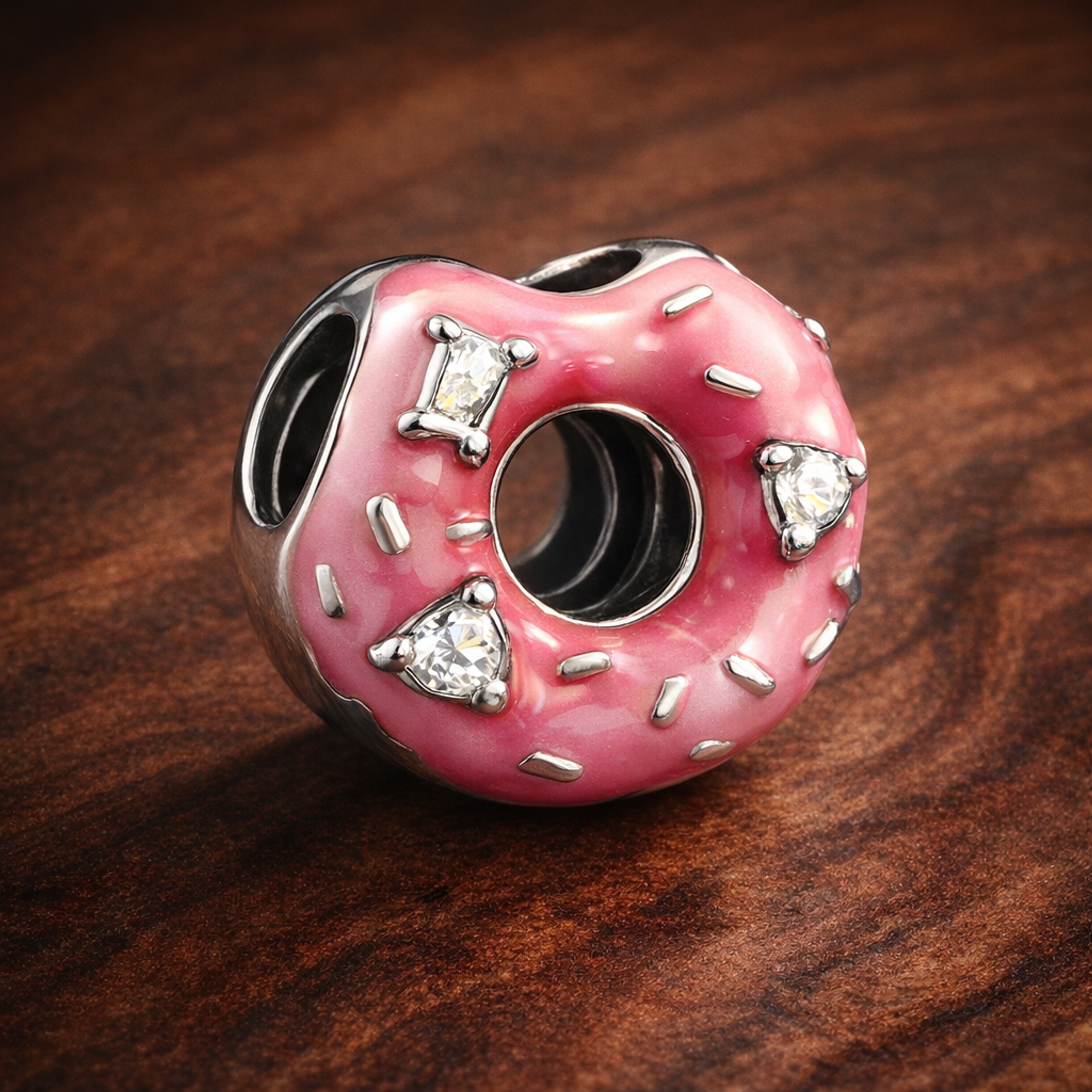 Sparkling Sprinkled Donut Charm — display on walnut