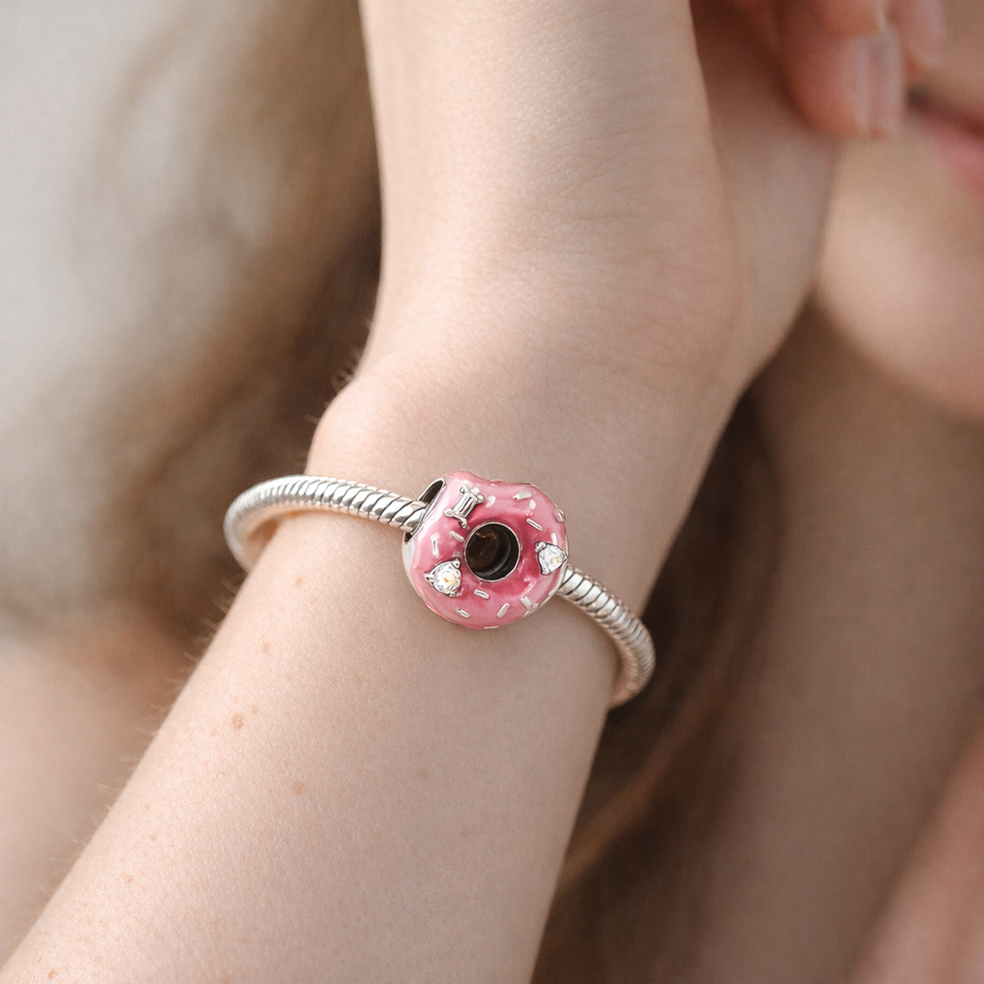 Sparkling Sprinkled Donut Charm — worn on wrist