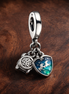 Camera, Heart & Compass Triple Dangle Charm — display on walnut