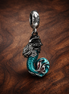 Disney The Little Mermaid Ariel Dangle Charm — display on walnut