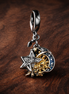 Two-tone Celestial Triple Dangle Charm — display on walnut
