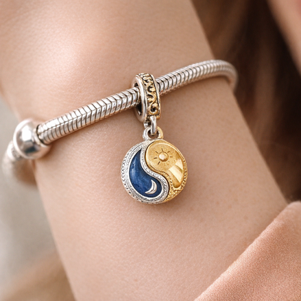 Two-tone Splittable Sun & Moon Dangle Charm — worn on wrist