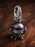 Disney The Little Mermaid Ursula Dangle Charm — display on walnut