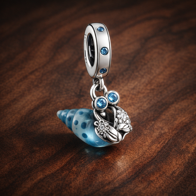 Glow-in-the-dark Hermit Crab Dangle Charm — display on walnut