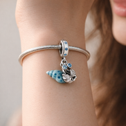 Glow-in-the-dark Hermit Crab Dangle Charm — worn on wrist