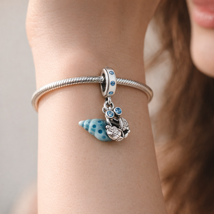 Glow-in-the-dark Hermit Crab Dangle Charm — worn on wrist