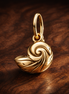 Disney The Little Mermaid Enchanted Shell Dangle Charm — display on walnut