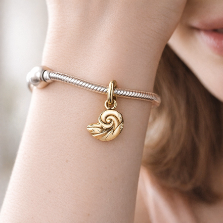 Disney The Little Mermaid Enchanted Shell Dangle Charm — worn on wrist
