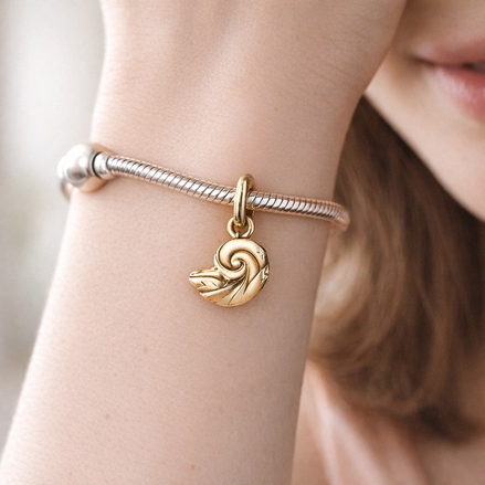 Disney The Little Mermaid Enchanted Shell Dangle Charm — worn on wrist
