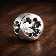 Open Clover Luck Charm - Open Four-Leaf Clover Charm — display on walnut