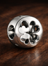 Open Clover Luck Charm - Open Four-Leaf Clover Charm — display on walnut