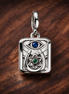 Blue Evil Eye Rectangle Charm - Blue Evil Eye Rectangular Dangle Charm — display on walnut