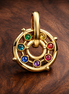 Rainbow Wheel Charm - Gold Plated Rainbow Stone Wheel Charm — display on walnut