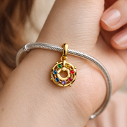 Rainbow Wheel Charm - Gold Plated Rainbow Stone Wheel Charm — worn on wrist
