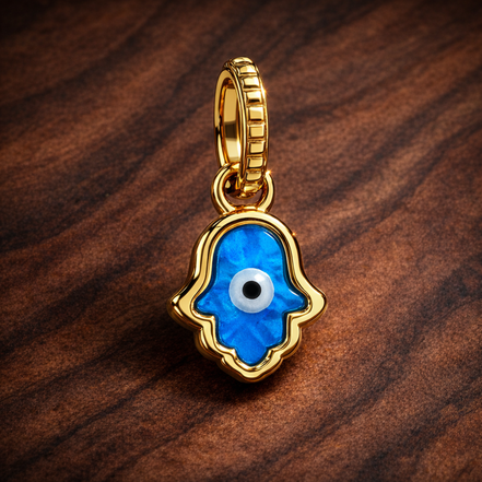 Opalescent Blue Hamsa Hand Dangle Charm — display on walnut
