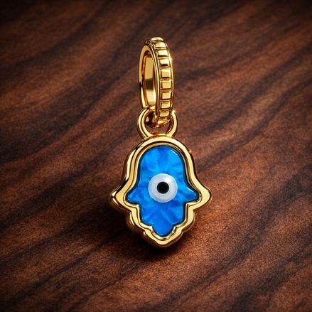 Opalescent Blue Hamsa Hand Dangle Charm — display on walnut